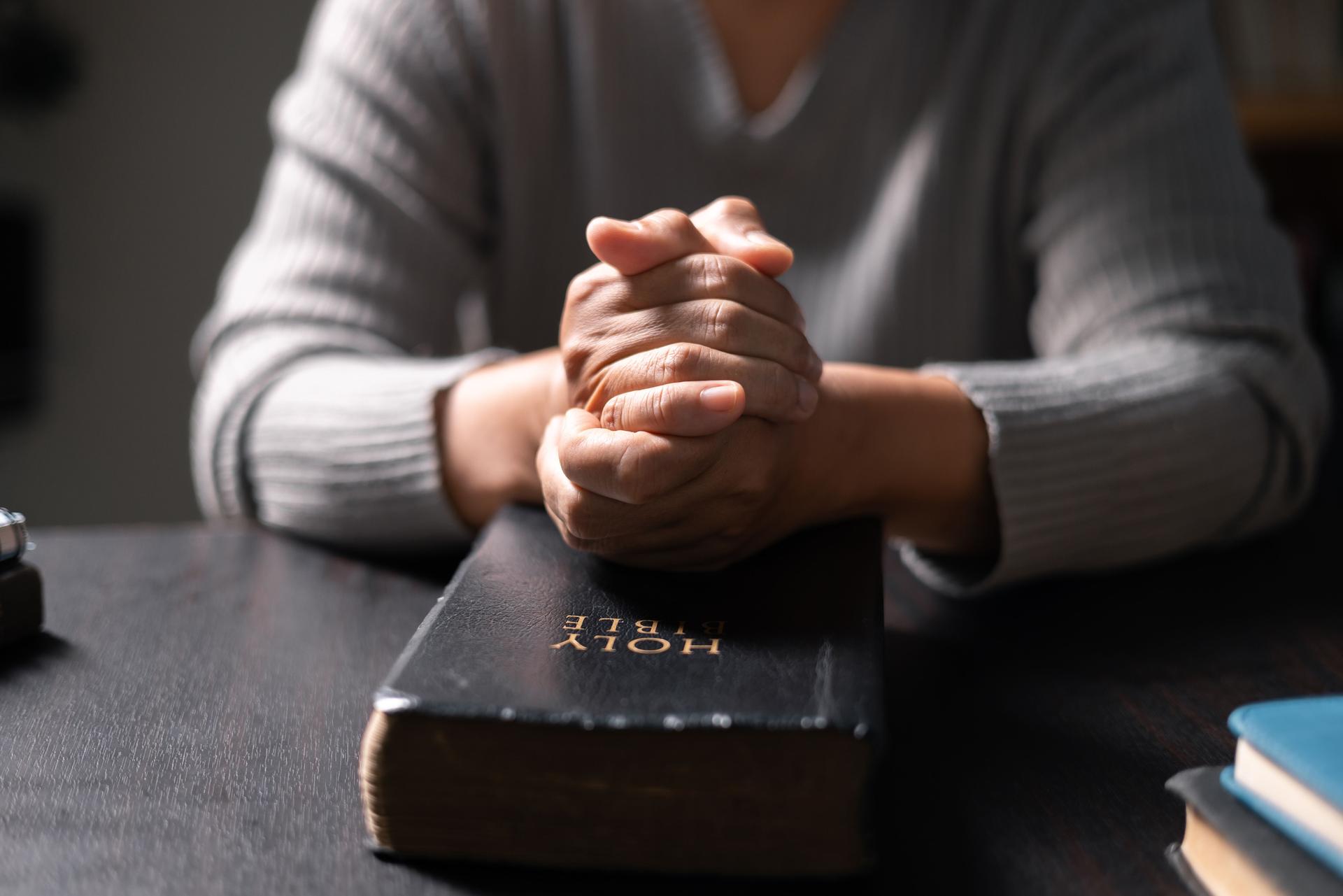 Woman with Bible in her hand, her faith unwavering as she prayed and worshiped God, finding strength and guidance in her Christian religion through the holy book. pray, woman, bible, faith, religion.