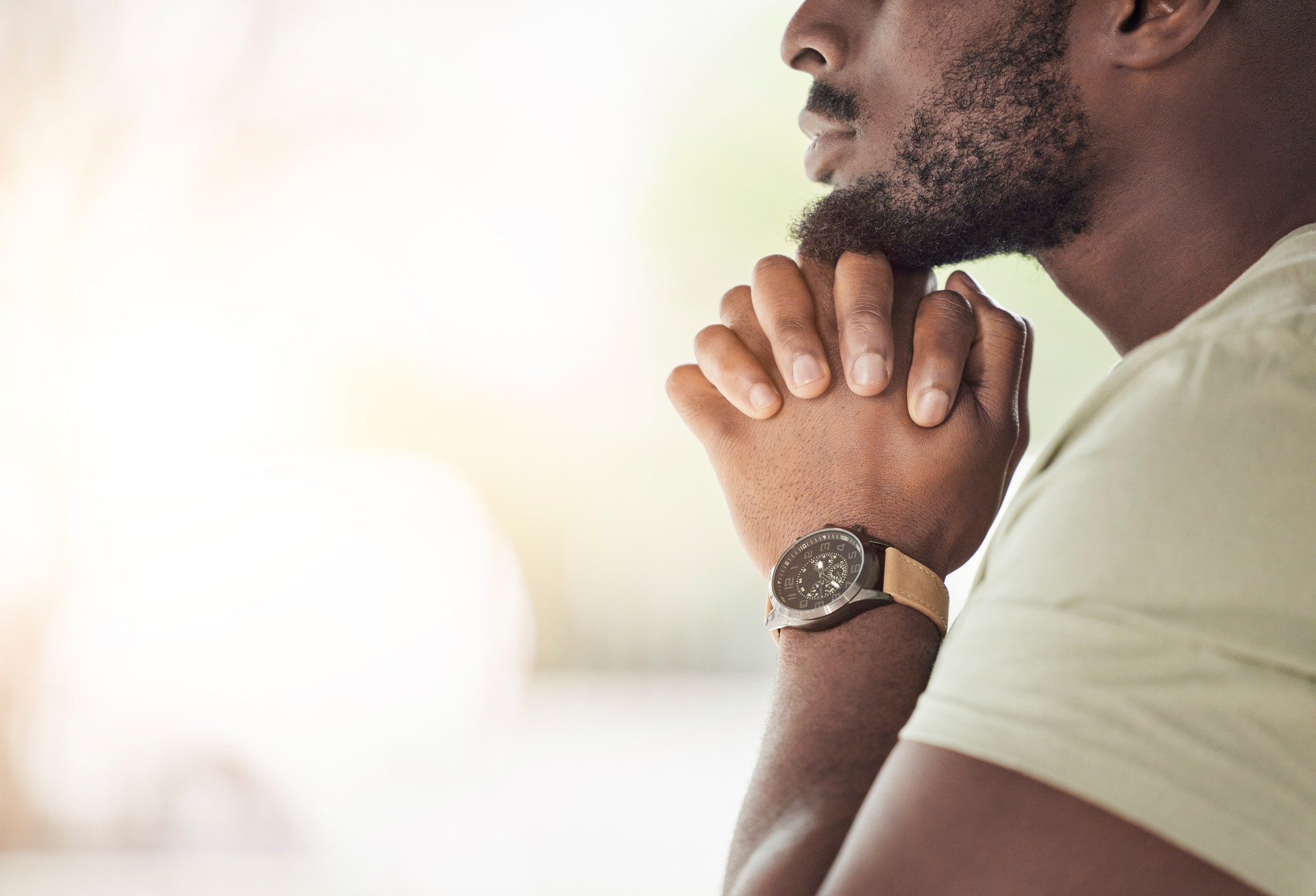 Prayer, religion and hands of man for worship, faith and belief for support, help and hope. Mockup space, praying and closeup of person in home for meditation, spiritual healing and trust for praise